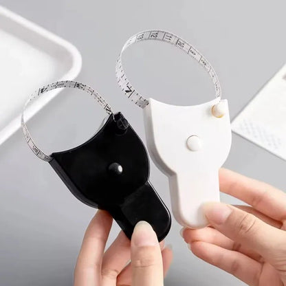 150cm / 60 Inch Self‑Lock Body Measuring Tape – Retractable Tailor & Fitness Measurement Tool - Saadiq.pk